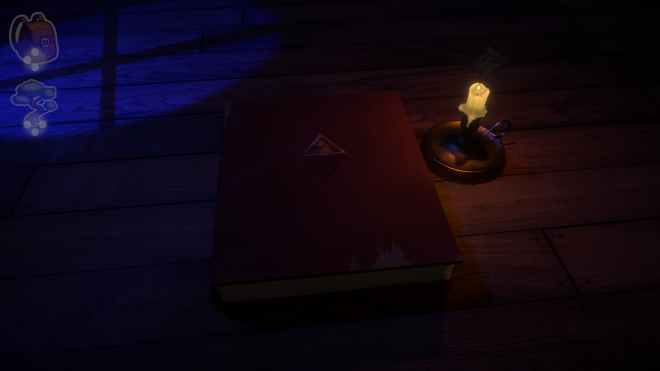 An old closed book on a table in a dark room beside a lit candle